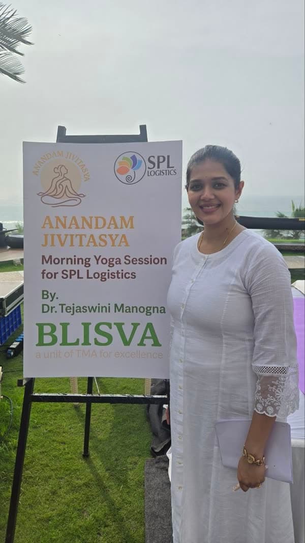 Dr. Tejaswini Manogna speaking at a yoga and wellness event in Hyderabad